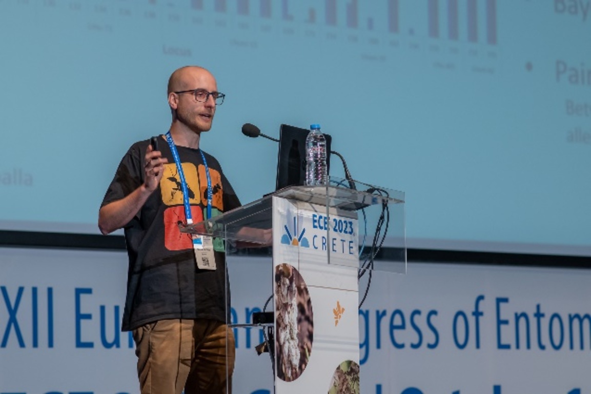 A person standing at a podium with a microphone